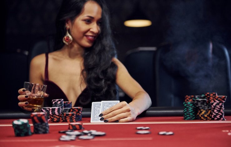 Mobile phone screen showing a bingo card at dax69 daftar with numbered grid, auto-marked numbers highlighted, and live dealer video feed